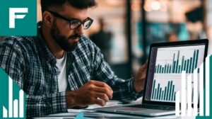Finance Certifications Guide - Man reviewing financial charts and data on a laptop.