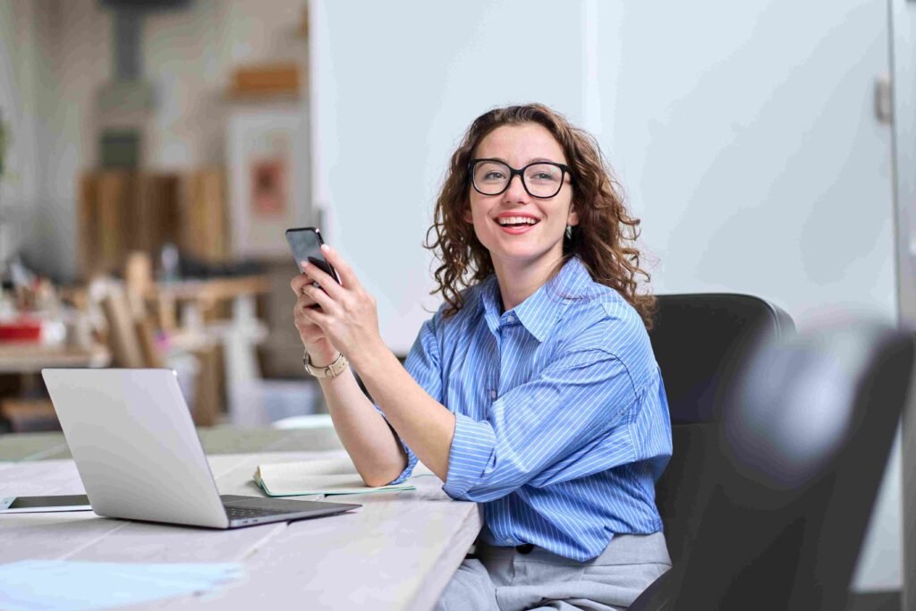 Financial analyst using bottom up modeling approach while working at a laptop in an office