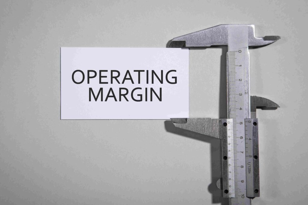 Card labeled operating margin placed inside a measuring tool representing financial performance analysis
