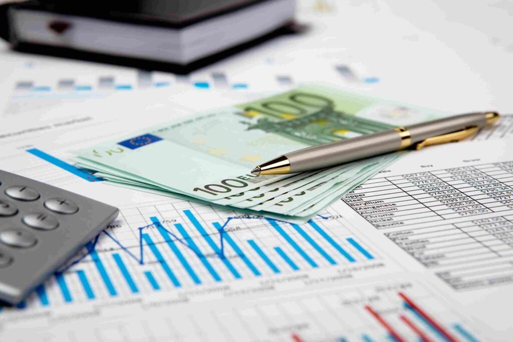 Business professional presenting a rising financial growth chart above a laptop