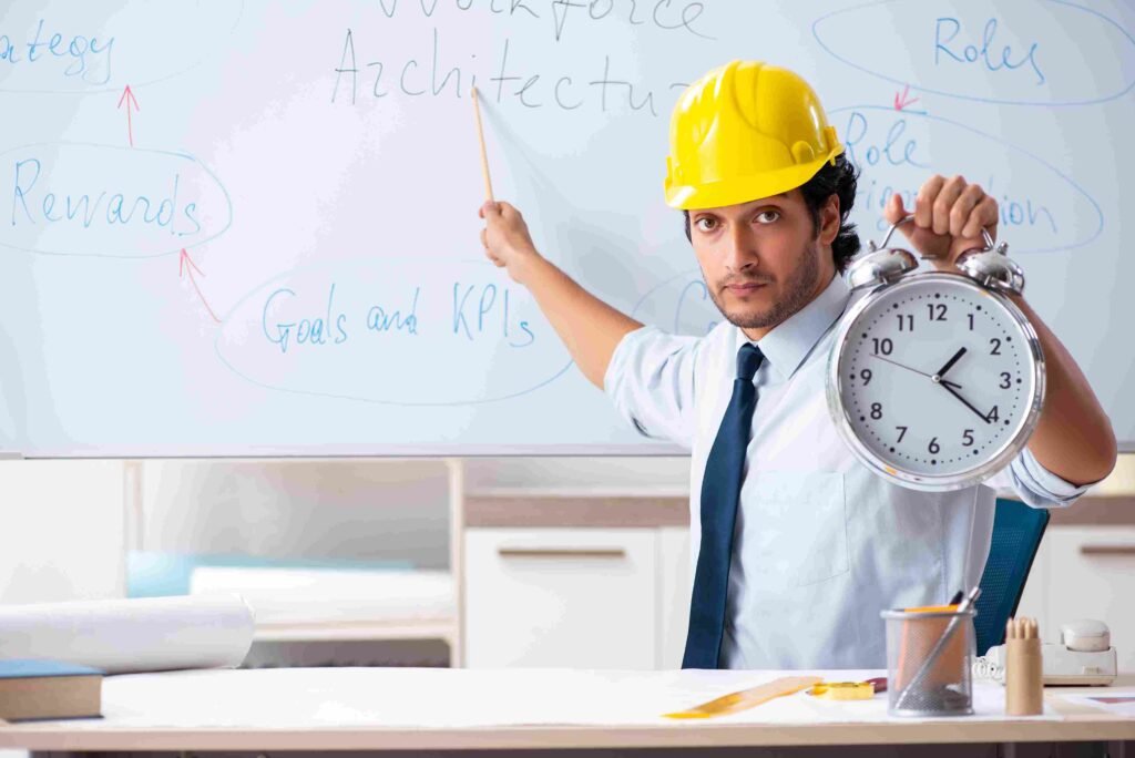 Professional wearing a hard hat points to a workforce planning diagram on a whiteboard while holding a clock, symbolizing employee tracking, workforce structure, and planning timelines