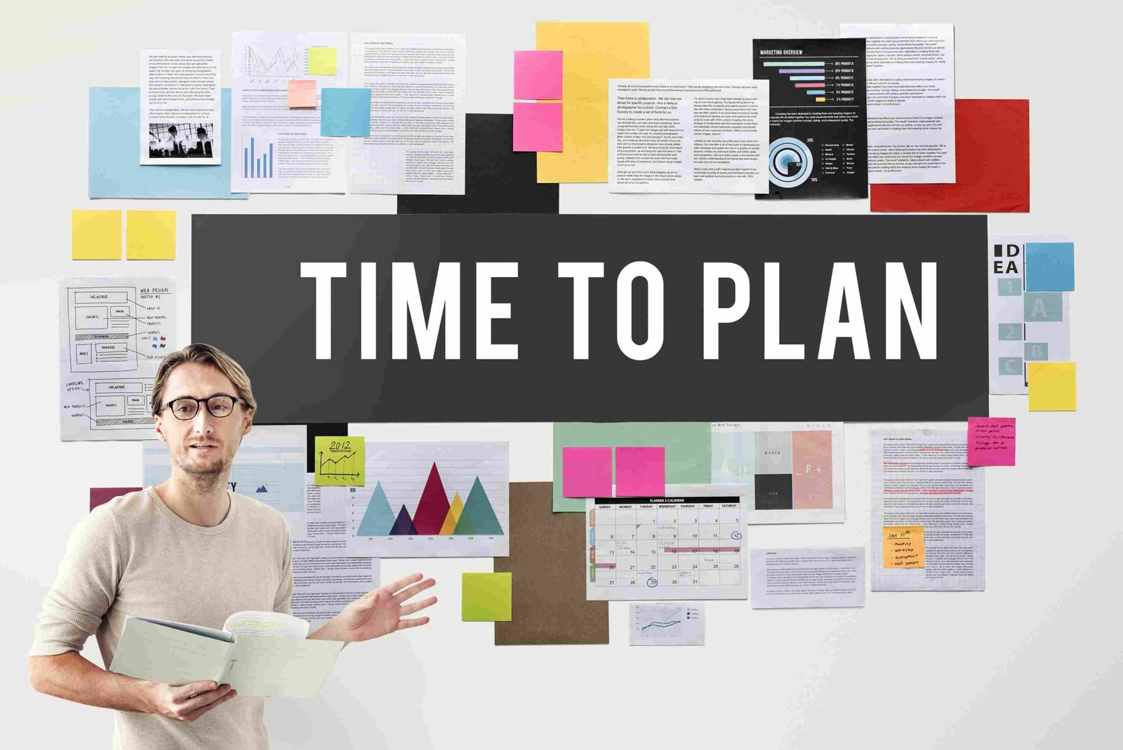 Professional presenting a headcount planning board filled with charts, schedules, notes, and workforce planning documents